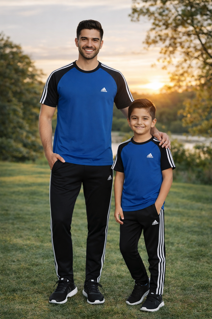 Father and son wearing matching navy and black Adi-Royal Navy/Black combo outfits by Superwear, standing together outdoors.