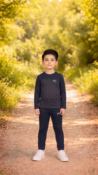 Kid's gray and navy dry-fit tracksuit by Superwear, featuring a long sleeve top and comfortable athletic design.