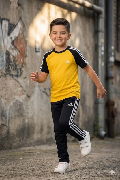 Kids' dry-fit tracksuit in yellow and black by Superwear, featuring a sporty design for active play and comfort.