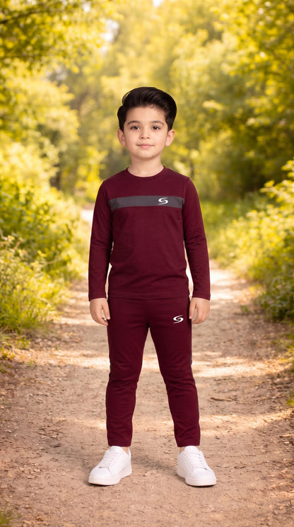Kid's dry-fit maroon and gray tracksuit by Superwear, featuring long sleeves and sporty design for active wear.
