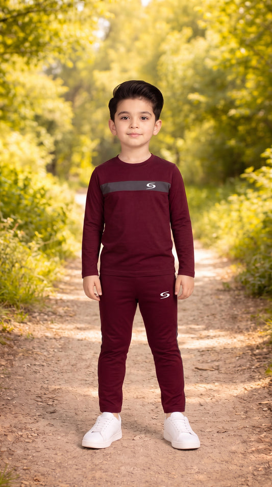 Kid's dry-fit maroon and gray tracksuit by Superwear, featuring long sleeves and sporty design for active wear.